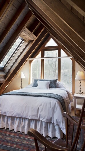 The spacious loft bedroom includes a sitting area for rocking to sleep