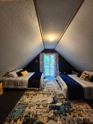 Bedroom #3 on the upper level with 2 Queen beds & a blow-up child's mattress.