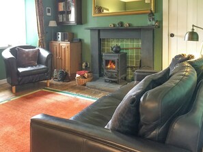 Sitting room with multi-fuel stove | Tigh Beag, Newtonmore