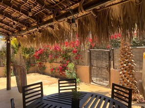 There is an outdoor shower on patio for rinsing sand off you and your beach toys