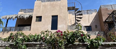 A front view of the villa showing all three levels.