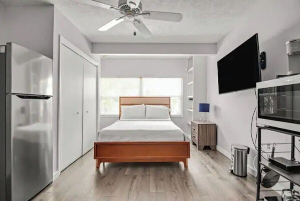 Queen sized bed with premium mattress and bed linens.