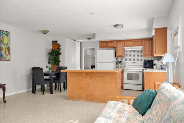 Full kitchen and a dining area.