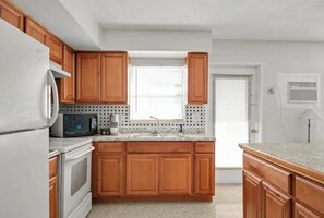 Microwave, stove, Keurig Coffee maker are included.