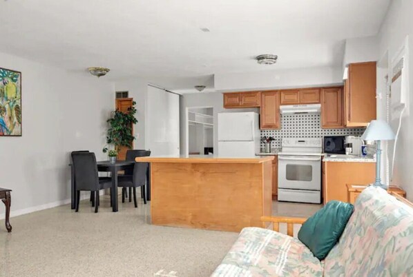 Full kitchen and a dining area.
