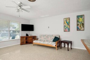 Cozy living room with 50" Smart TV.