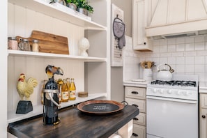 Butcher block table with stool and complimentary wine