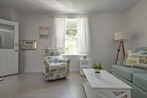 Cozy living room with sofa and recliner.
