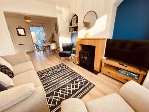 Living room with comfy seating and TV