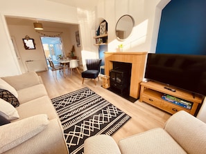 Living room with comfy seating and TV