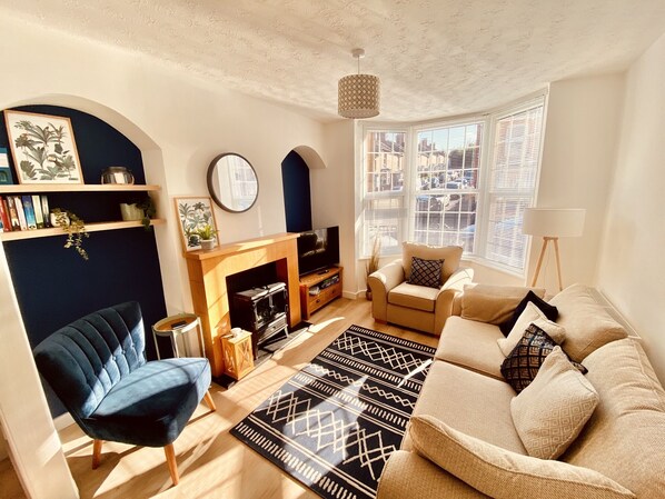 The living room, with smart TV and electric fireplace 