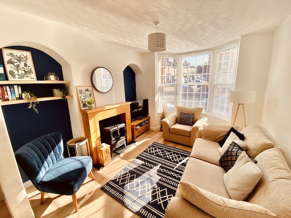 The living room, with smart TV and electric fireplace