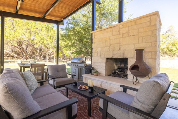 Covered patio with living and dining areas