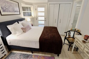 Bedroom includes plenty of storage and a queen sized bed 