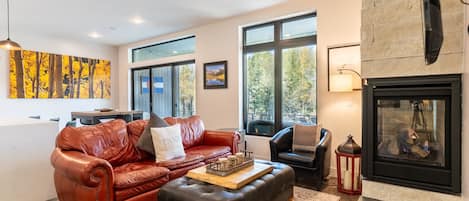 Living area featuring a gas fireplace and cozy furnishings.