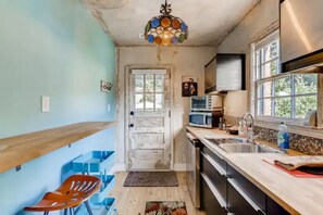 Kitchen with bar counter large enough for a laptop