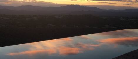 Sunrise reflecting off of your private infinity pool.
