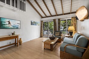 Relax in the Kona Surf House Ohana Room that features comfortable seating