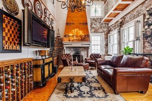 Living room with TV and fireplace