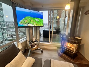 LG OLED 55 inch smart tv with breathtaking views and a fireplace.