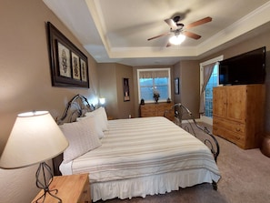 Spacious Master Bedroom with vaulted ceilings & fan. Beautiful bay window view!