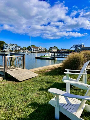 We provide a private waterfront seating area with two Adirondack chairs.