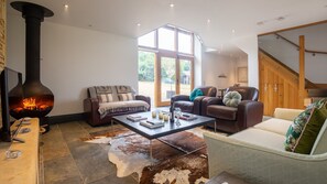 Suspended fireplace and living area, Spring Barn, Bolthole Retreats