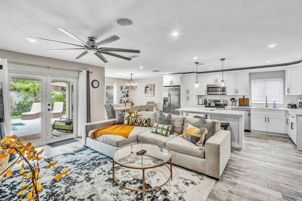 Clean lines, pops of color, and a touch of mid-century modern flair - this living room is where style meets comfort.