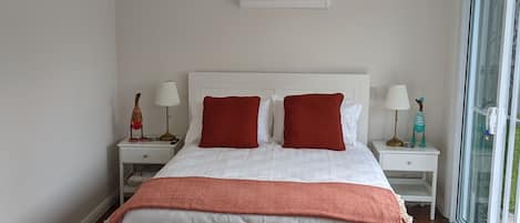 The queen size bed with reverse cycle air conditioning.