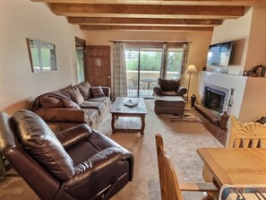 Living Area with overstuffed leather furniture and smart TV