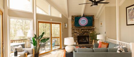 Our great room is filled with sunlight and a 65" TV over the (NW) fireplace. 