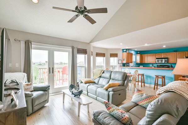 Open-concept living room and kitchen. Come entertain the whole family. 