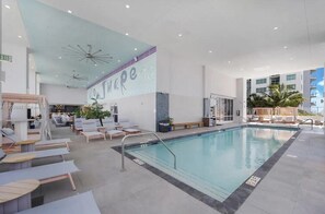 Urban Elegance, Poolside Bliss: Dive into sophistication at our indoor pool, seamlessly integrated into the chic ambiance of this Miami apartment building. Elevate your stay with a refreshing swim.