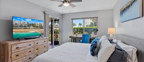 Beach Way Getaway - a SkyRun Sarasota Property - Primary Bedroom - Primary bedroom suite with private bath and access to lanai. Large HDTV, walk in closet and hotel quality linens. 