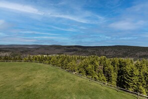 Enjoy the serene mountain views from the brand new 7' x 7' galvanized steel deck with seating for two people.  Don't forget to wake up early to watch the beautiful sunrises!