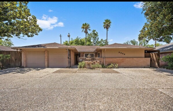 RESORT-LIKE home with a huge driveway.