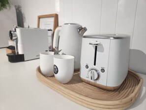 The Kitchenet is equipped with Bar Fridge, Coffee Machine, Coffee Pods Kettle, Tea & Toaster, Cutlery, Plates,  Glasses. 