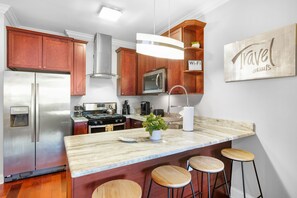 Kitchen comes equipped with all pots, pans, cookware, dishware and flatware.  All the amenities you need to make a great home cooked meal or a night to order in.