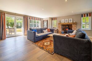Foxhole Cottage, Framsden: Sitting room with wood burning stove