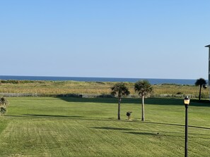 Beautiful gulf view and grassy area for kids and adults to play. ~ Pointe West Vacation ~