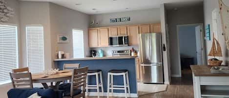 Living Room, Dining Area, Kitchen with all new appliances.