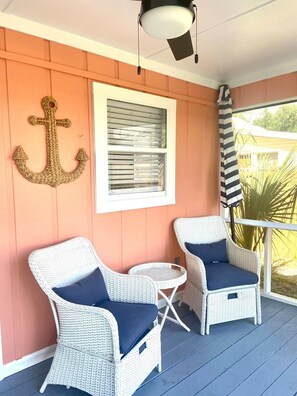 Screened in back porch where you can enjoy the fully fenced-in back yard