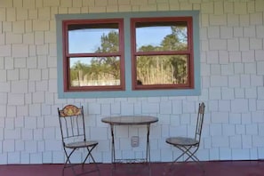 Front screened in porch overlooking the pond.
