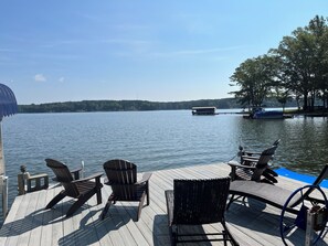 Dock has 4 Adirondack & 2 sunning chairs.  Water is ~7ft deep with ladder.