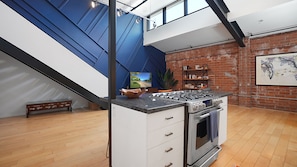 The kitchen & living room areas flow seamlessly together in this open floor plan