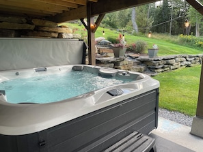 Enjoy a soak in the hot tub under the lights.