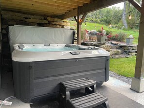 Hot tub under the deck with outdoor Sonos speakers!