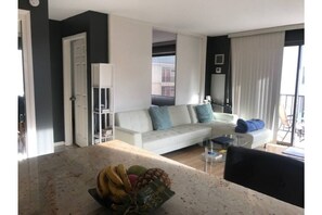 View from Kitchen showing bedroom door entry and bedroom sliding wall