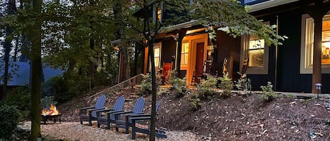 The house at night really comes alive glowing while outside at the fire pit.