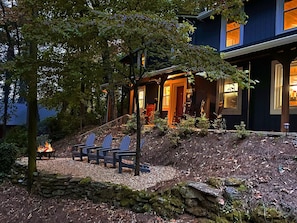 The house at night really comes alive glowing while outside at the fire pit.